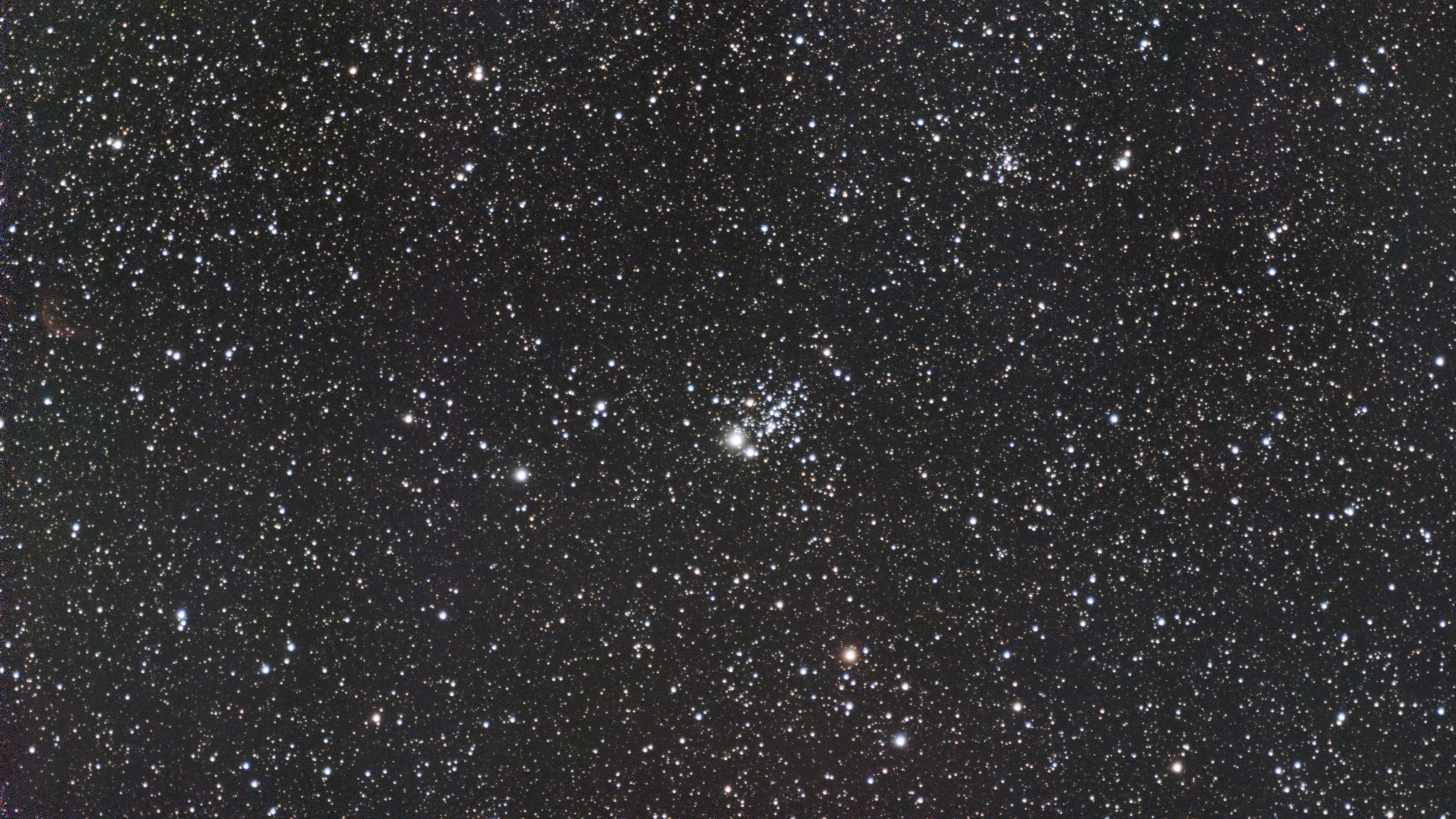 The Owl Cluster, NGC 457, in a dense star field